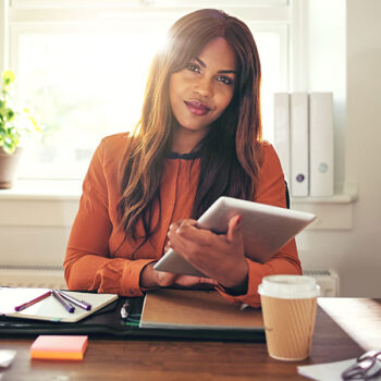 confident-young-woman-using-a-tablet-in-her-home-o-PAP4V2Y.jpg